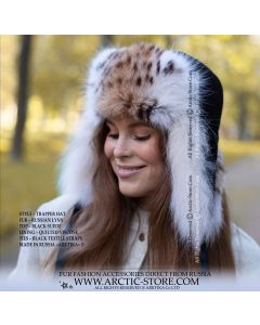 Women’s Russian lynx fur trapper hat in black suede crown. Natural lynx fur with soft balanced spots, designed for women’s winter fashion and cold-weather protection.