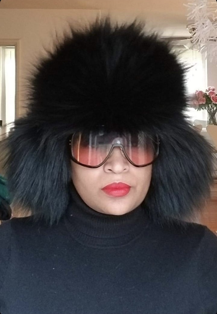 woman wearing black raccoon fur ushanka hat
