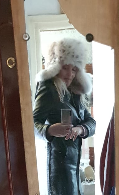 woman wearing luxury Russian lynx fur ushanka hat