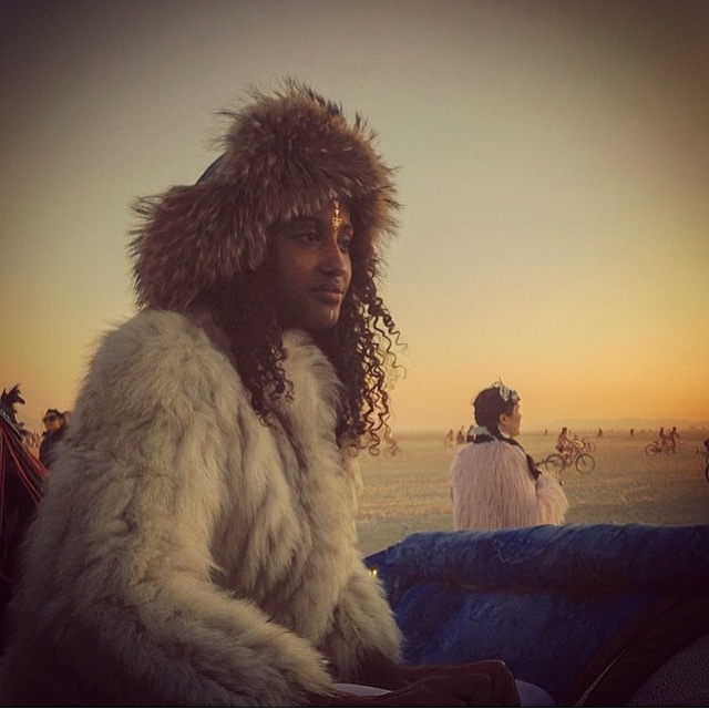 woman wearing raccoon fur trapper hat