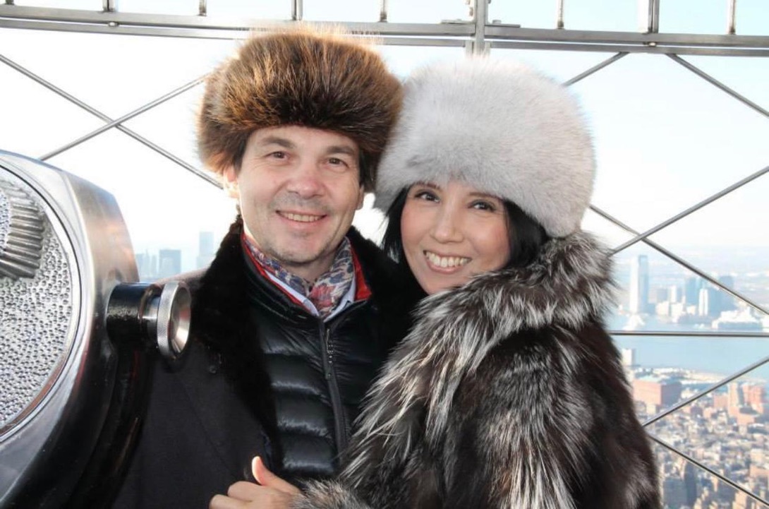 man wearing round full fur hat made of polar blue fox