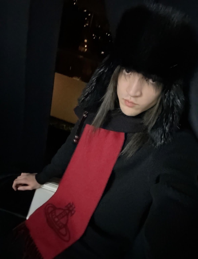 man wearing officer-style black beaver fur hat