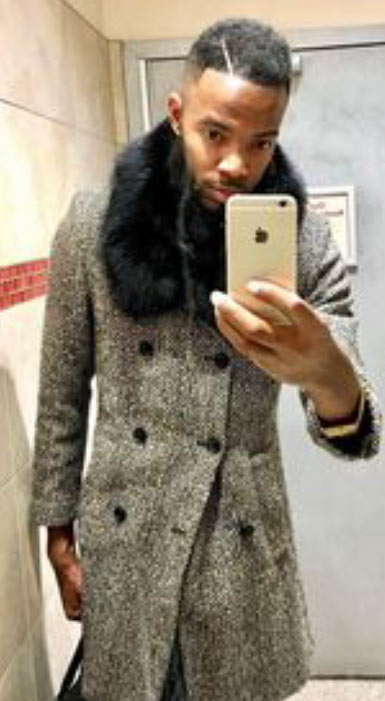 man wearing classic black fox fur collar