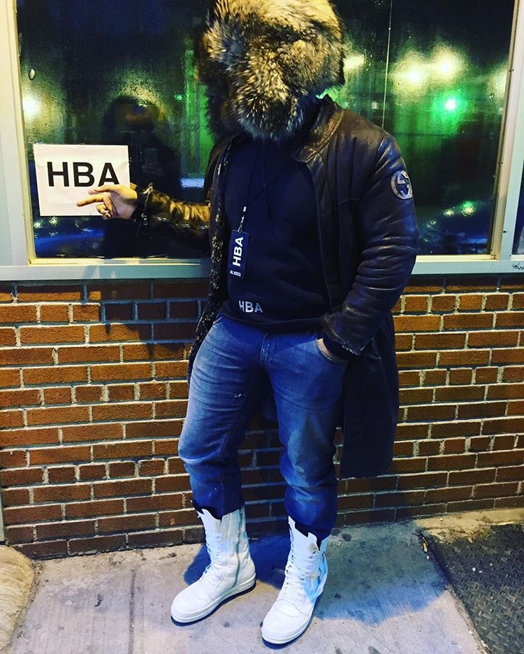 man wearing full fur Russian ushanka hat with raccoon fur