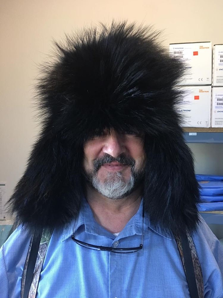man wearing black raccoon fur ushanka hat