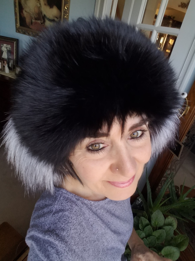 woman wearing black and silver fox fur headband