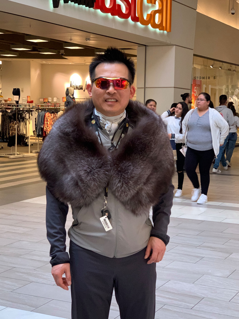 man wearing wide pelerine wrap with silver grey fox fur
