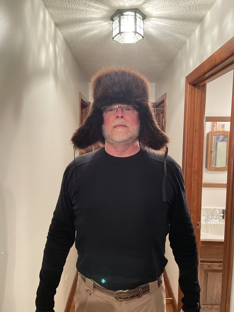 man wearing Siberian ushanka hat with golden beaver fur