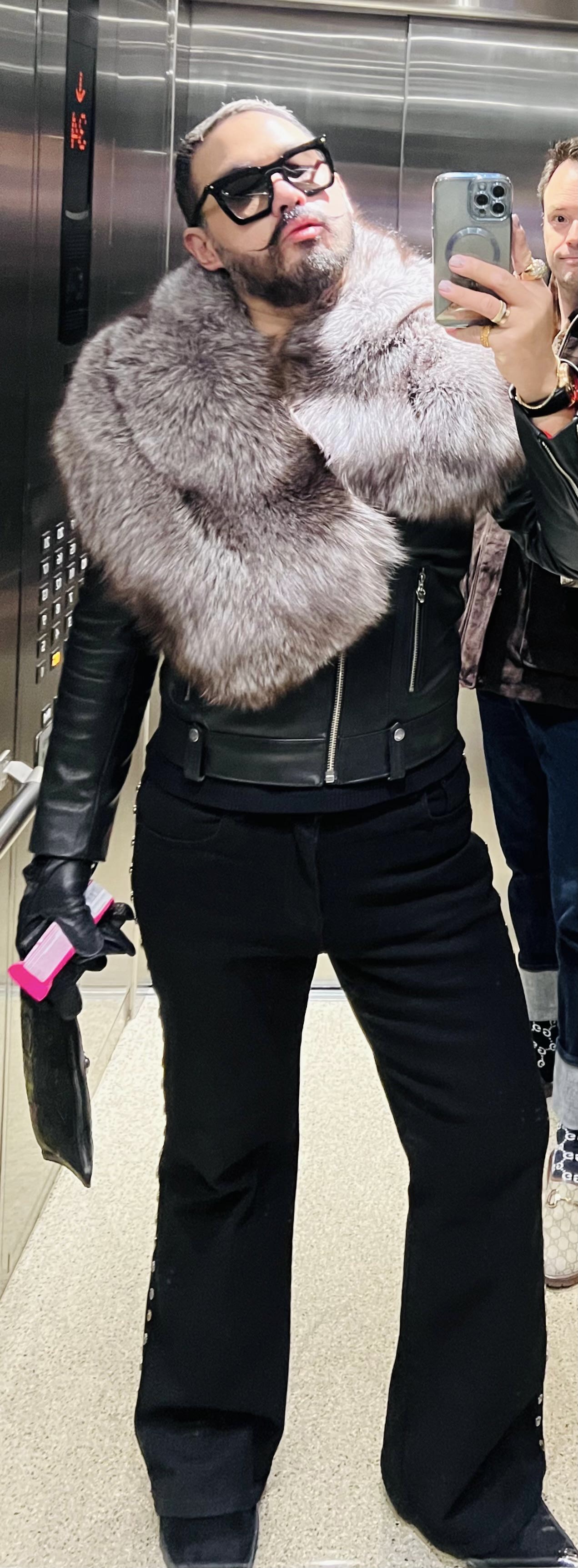man wearing wide silver grey fox fur pelerine