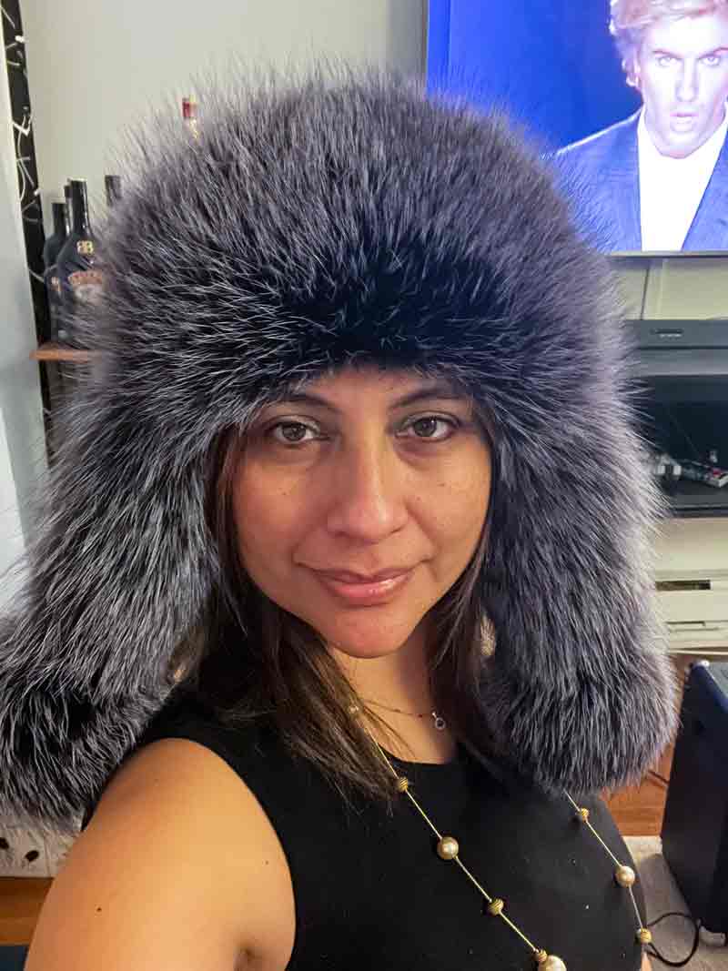 woman wearing bomber ushanka hat with blue frost fox fur