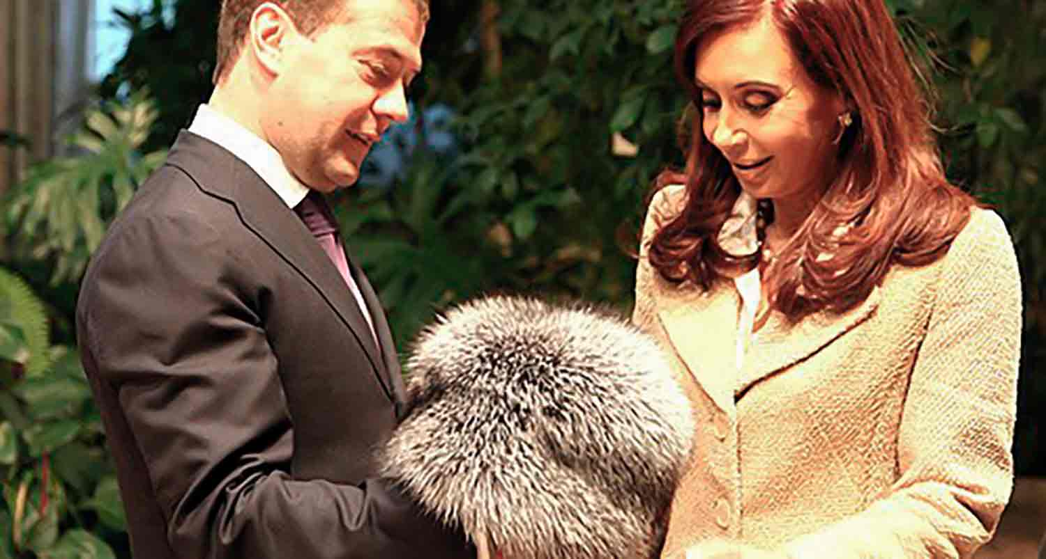 Russian President gifts fur hat to Argentine President Cristina Kirchner during official visit at the Kremlin.